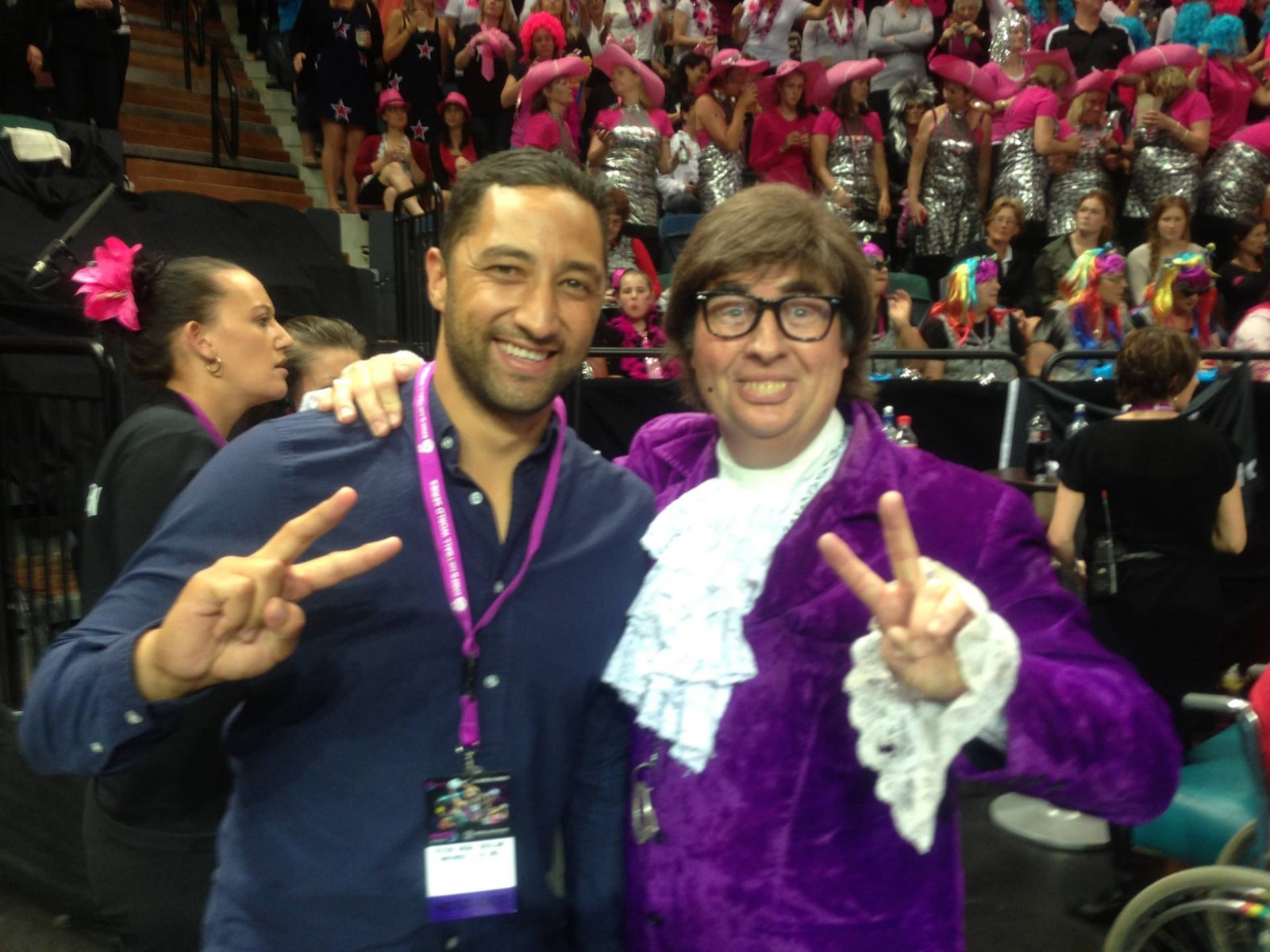 Austin Powers throwing a peace sign with a rugby league star at the Wellington Sevens