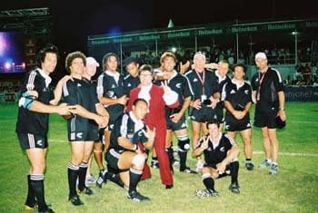 Austin Powers with a women's rugby team on the field
