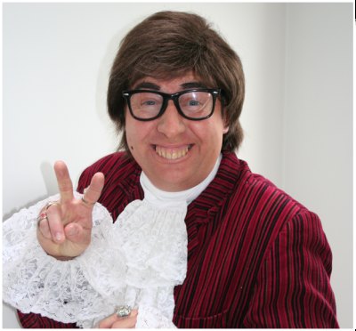 Gary Brown in character as Austin Powers giving a peace sign