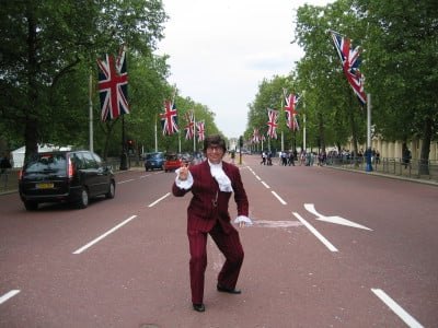 Austin Powers walking down a London street lined with Union Jacks