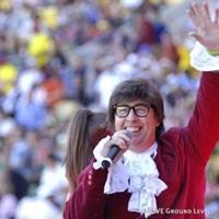 Gary Brown performing as Austin Powers in front of a stadium crowd