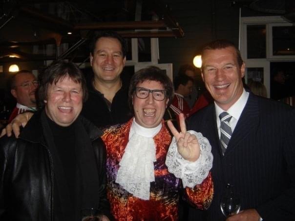 Austin Powers with guests at an evening corporate function