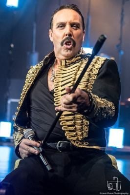 Freddie Mercury tribute artist in a military jacket