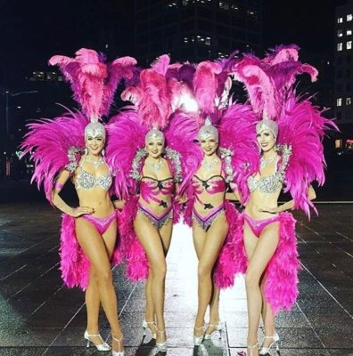 Showgirls in pink feathered Vegas costumes